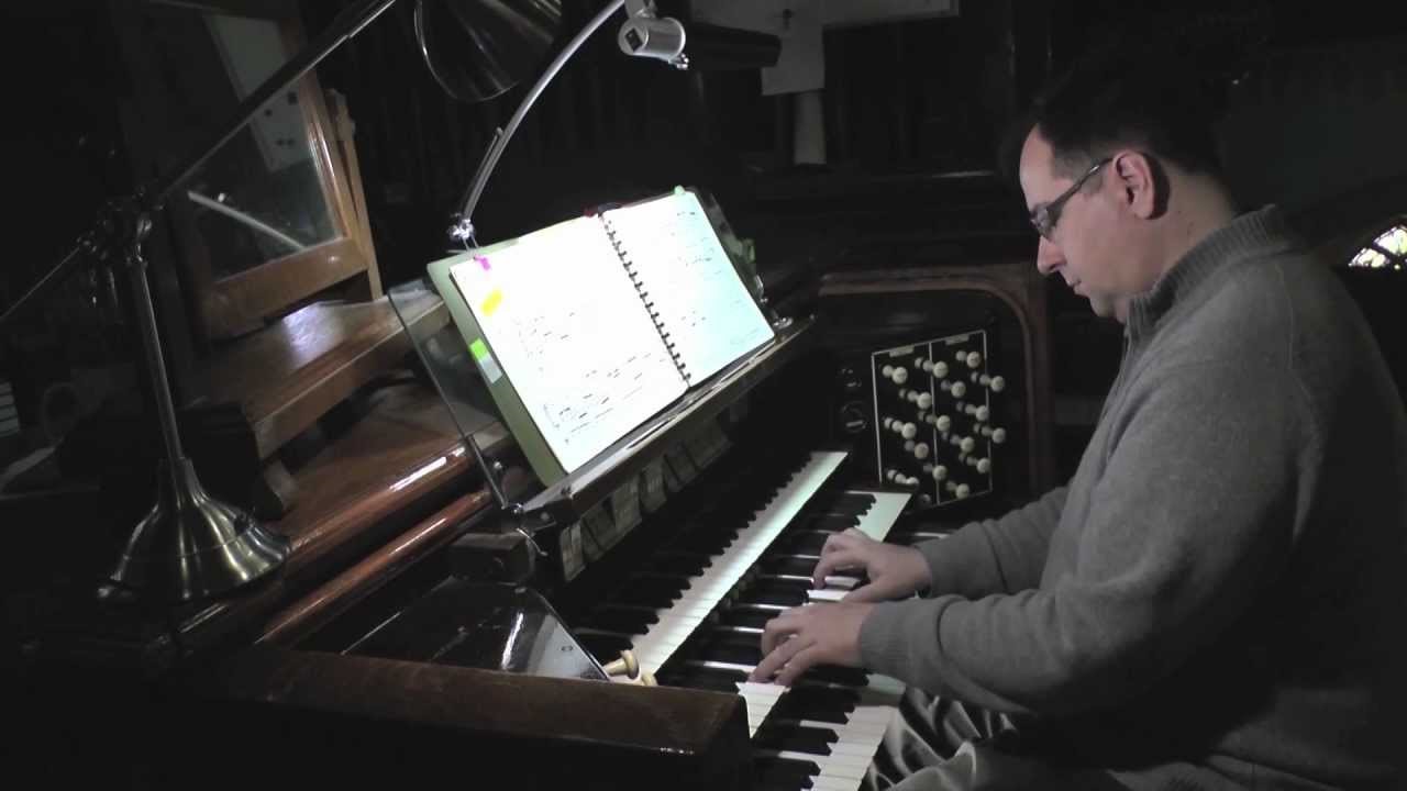 Photograph Gilles Maurice playing organ