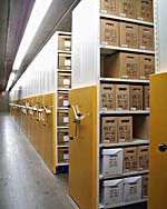 Photograph of the mobile shelving units used to store boxed textual records.