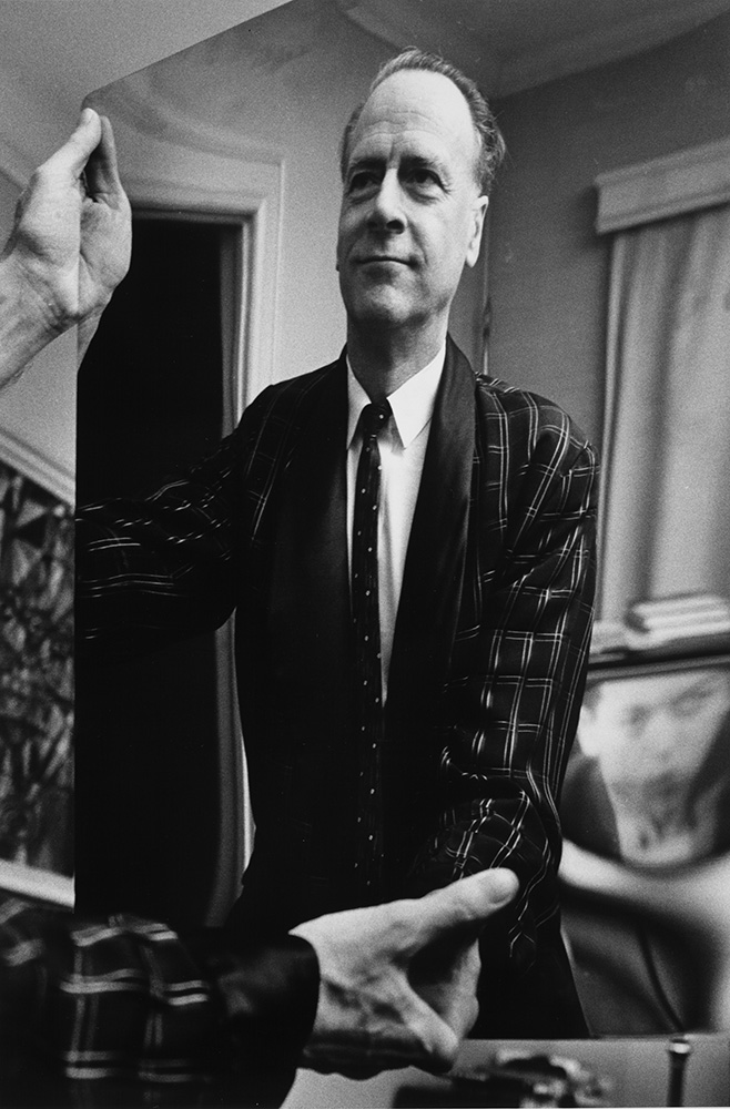Photographic portrait of Marshall McLuhan looking at his reflection in a mirror, 1967. Photo: John Reeves Source: e008295857