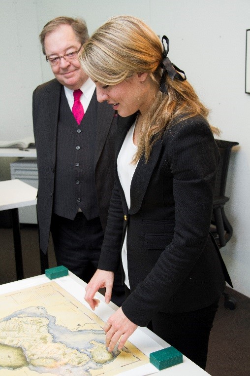The Honourable Mélanie Joly, Minister of Canadian Heritage, and Guy Berthiaume, Librarian and Archivist of Canada, view a map of Montreal at the LAC Preservation Centre in Gatineau, Quebec.