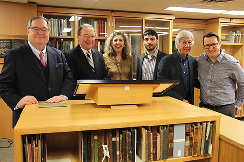 From left to right: Dr. Guy Berthiaume, the Honourable Rafael Barak, Leah Cohen, Rabbi Michael Kent, Dr. Norman Barwin and Dr. Howard Fremeth posing for the camera in front of the engraved map of the Holy Land.